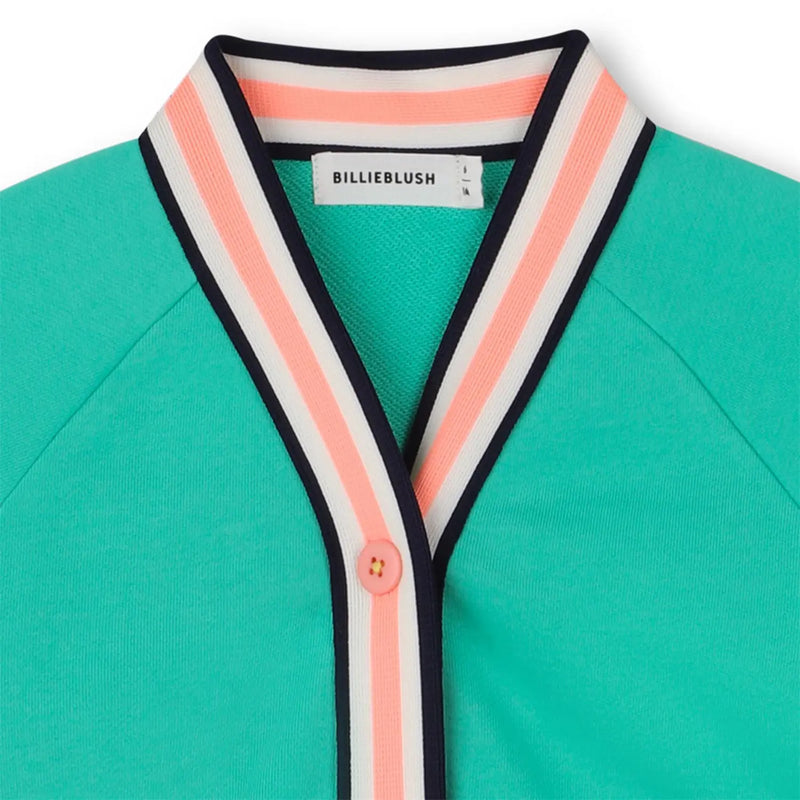 Closer look at the Billieblush cardigan showing detail of the striped trim