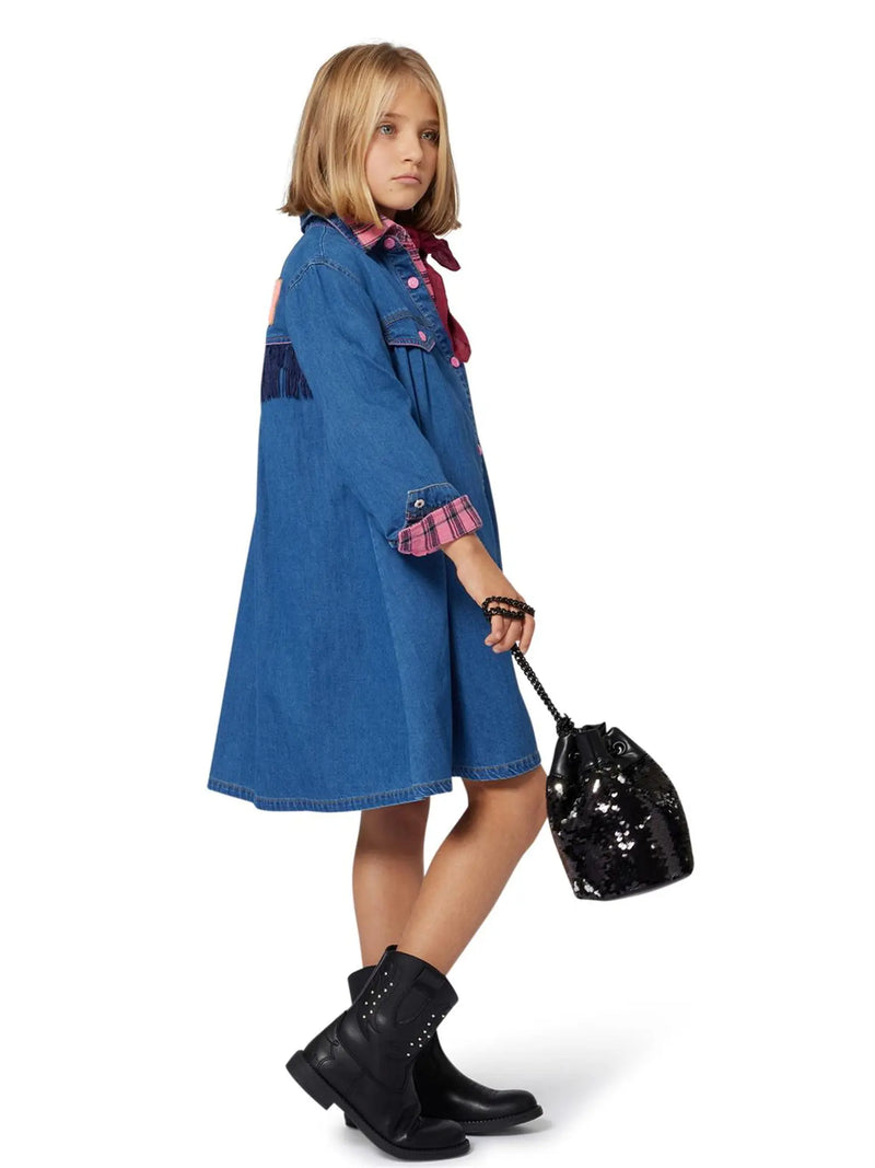 Girl modelling the Billieblush denim dress.