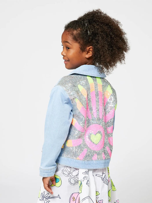 Girl modelling the Billieblush denim jacket.