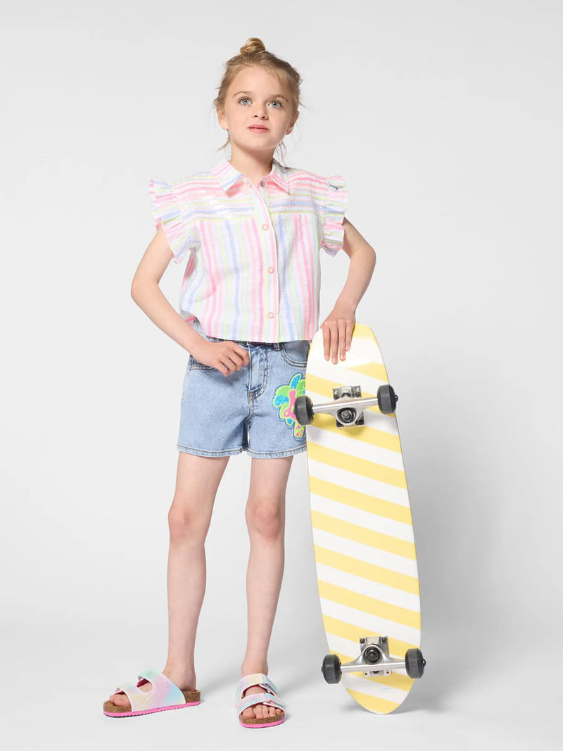 Girl wearing the Billieblush denim shorts.