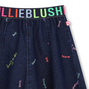 Closer look at the Billieblush denim skirt showing detail of the colourful logo waistband.