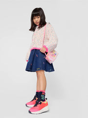 Girl in blue denim skirt by Billieblush.