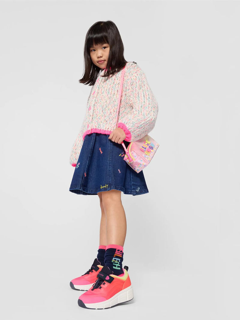 Girl in blue denim skirt by Billieblush.
