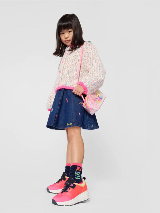 Girl in blue denim skirt by Billieblush.