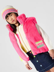 Girl modelling the Billieblush faux fur gilet.
