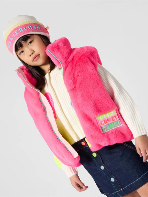 Girl modelling the Billieblush faux fur gilet.
