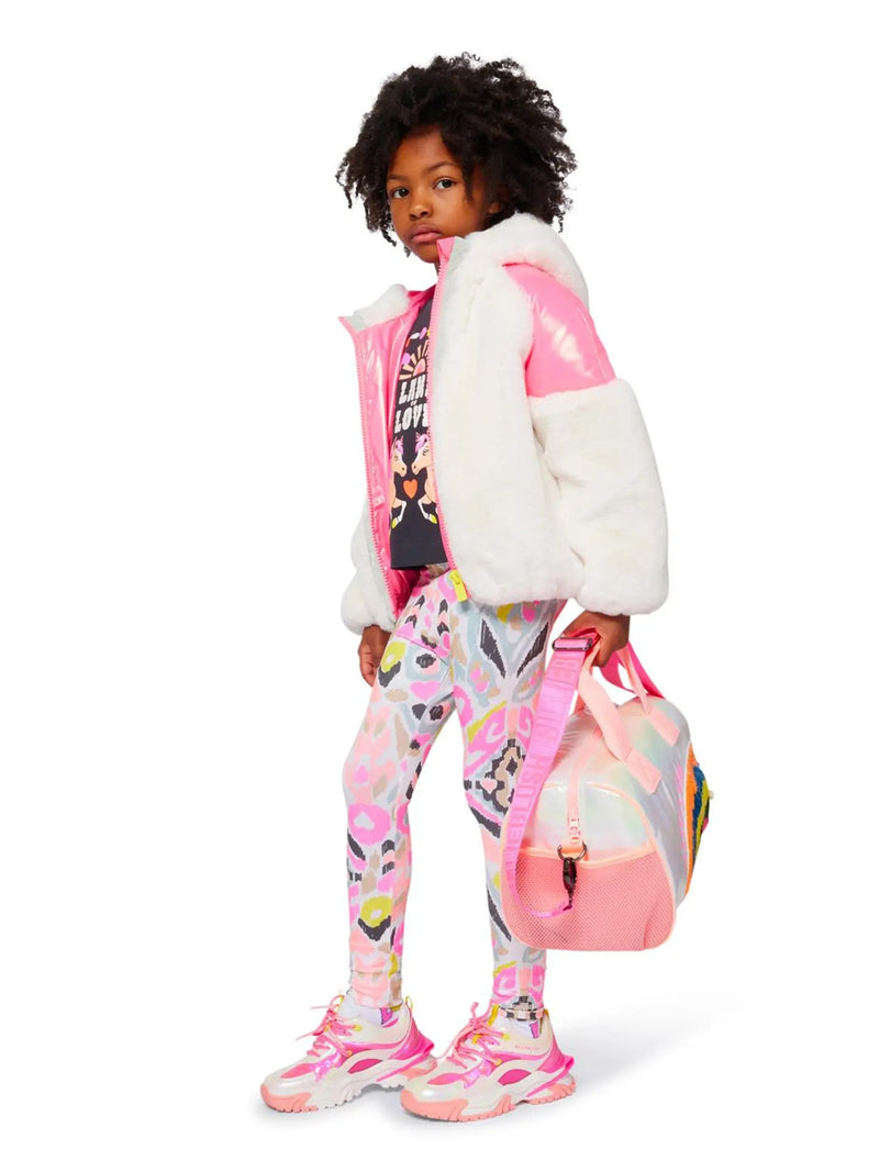 Girl modelling the Billieblush printed leggings.