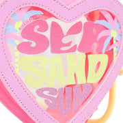Closer look at the Billieblush heart bag showing detail of the pink and yellow glitter slogan.