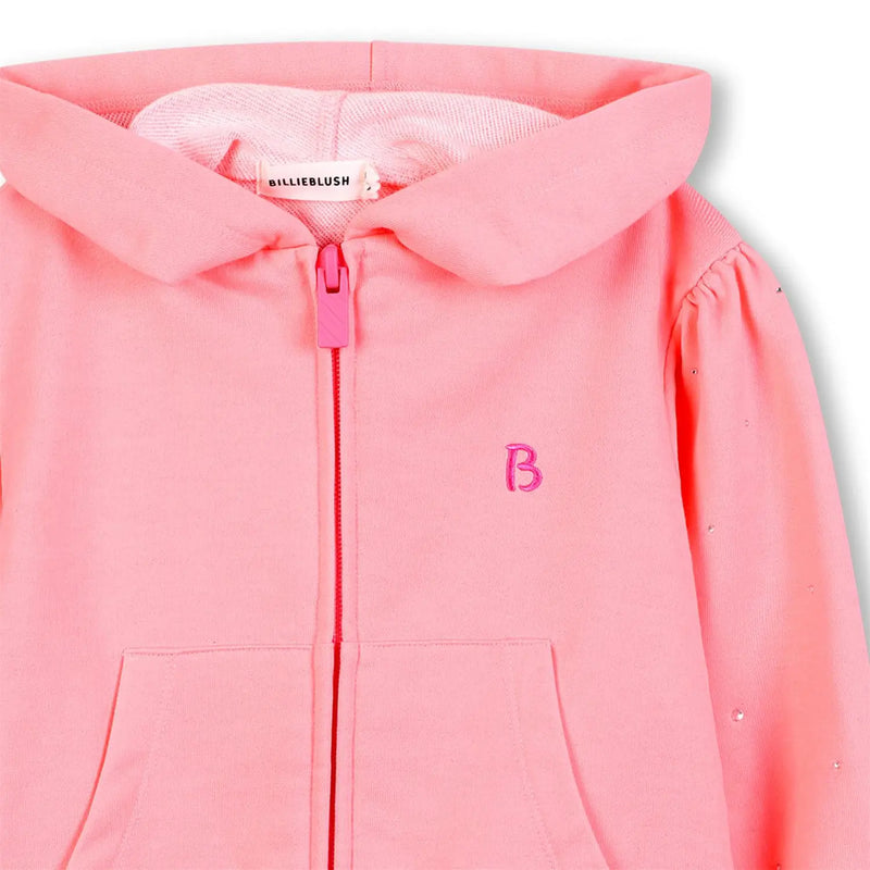 Closer look at the Billieblush hoodie showing detail of the embroidered logo on the chest