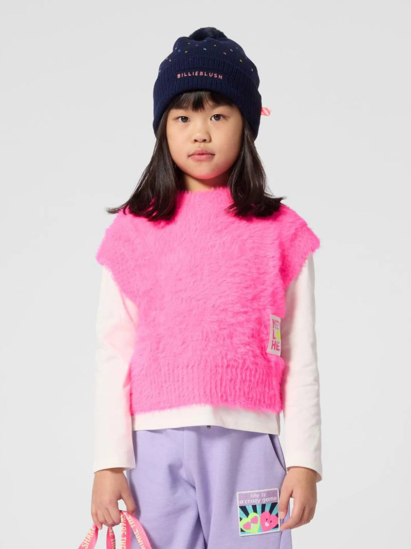 Billieblush pink knitted tank top, modelled by girl.