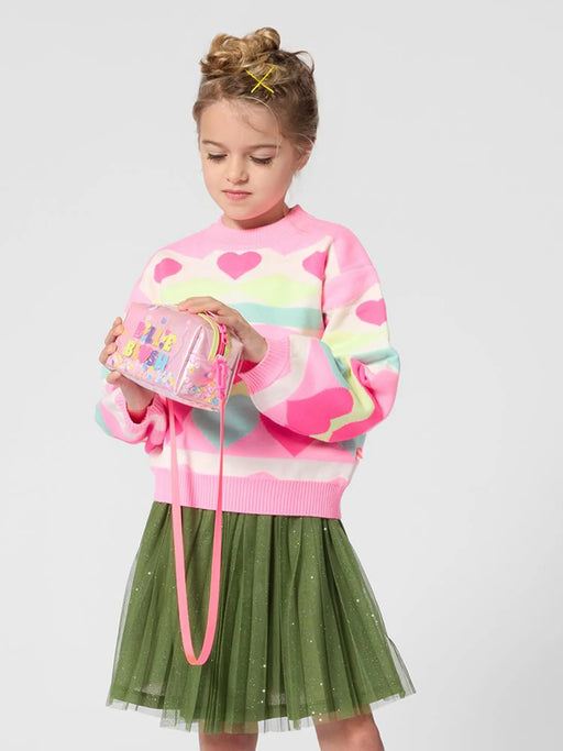 Girl wearing the Billieblush pink heart jumper.