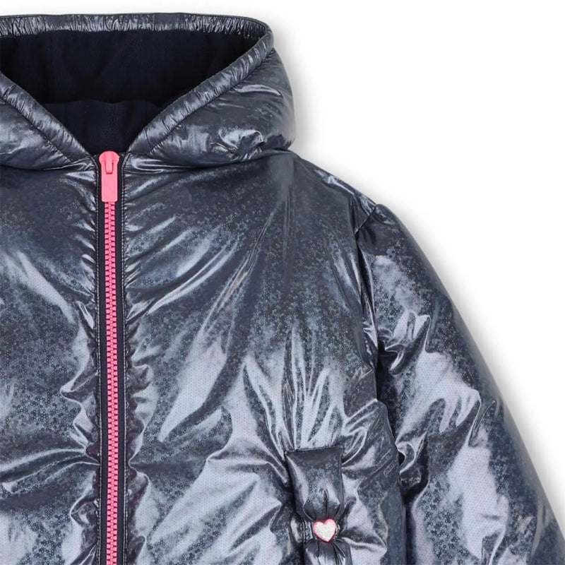 Closer look at the Billieblush puffer jacket showing detail of the contrasting pink zipper.