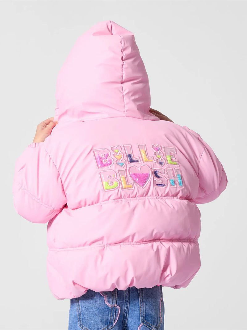 Billieblush pink puffer jacket, modelled by girl.