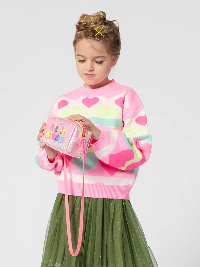 girl modelling the Billieblush sequin bag.