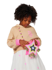 Girl modelling the Billieblush star bag.