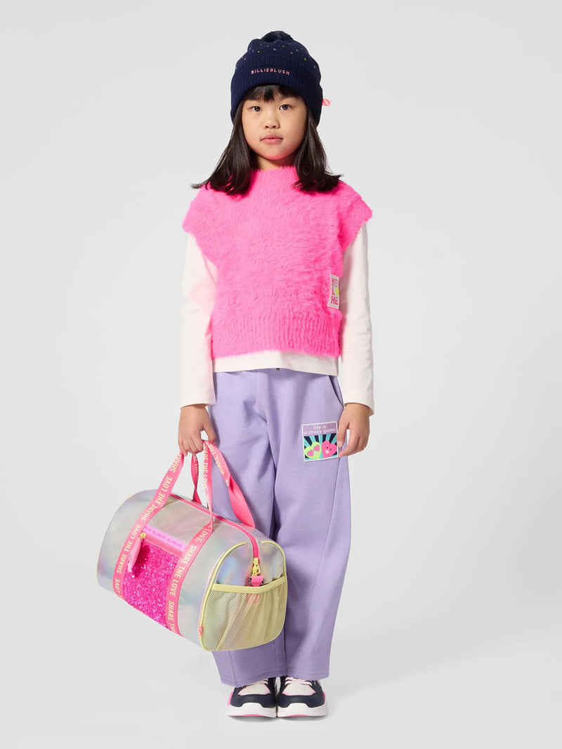 Girl modelling the Billieblush track bottoms.