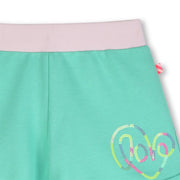 Closer look at the Billieblush track shorts showing detail of the coloured sequin logo.