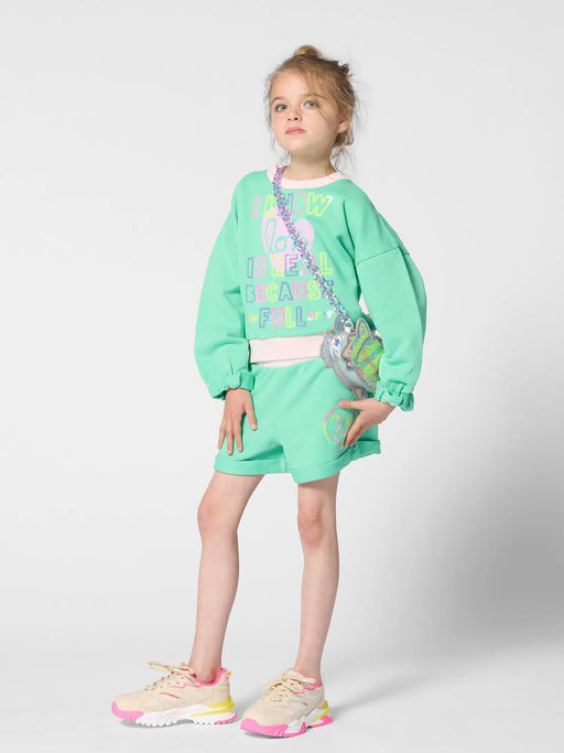 Girl modelling the Billieblush shorts set.