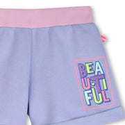 Closer view of the Billieblush track shorts.