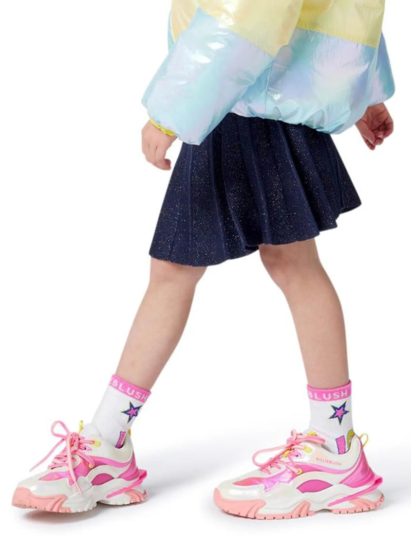 Girl wearing the Billieblush trainers.
