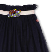Closer look at the Billieblush tulle skirt showing detail of the purple heart logo.