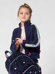 Smiling Girl modelling the Billieblush sequin sleeve sweatshirt.