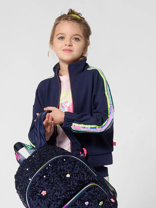 Smiling Girl modelling the Billieblush sequin sleeve sweatshirt.