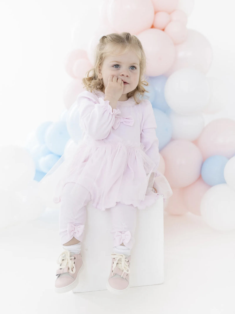 Baby girl modelling the Blues Baby helsinki dress set.
