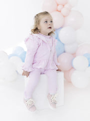 Baby girl modelling the Blues Baby maribo tracksuit.