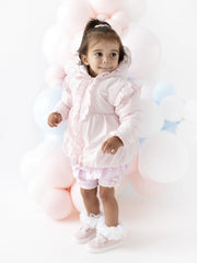 Baby girl wearing the Blues Baby ostra coat.