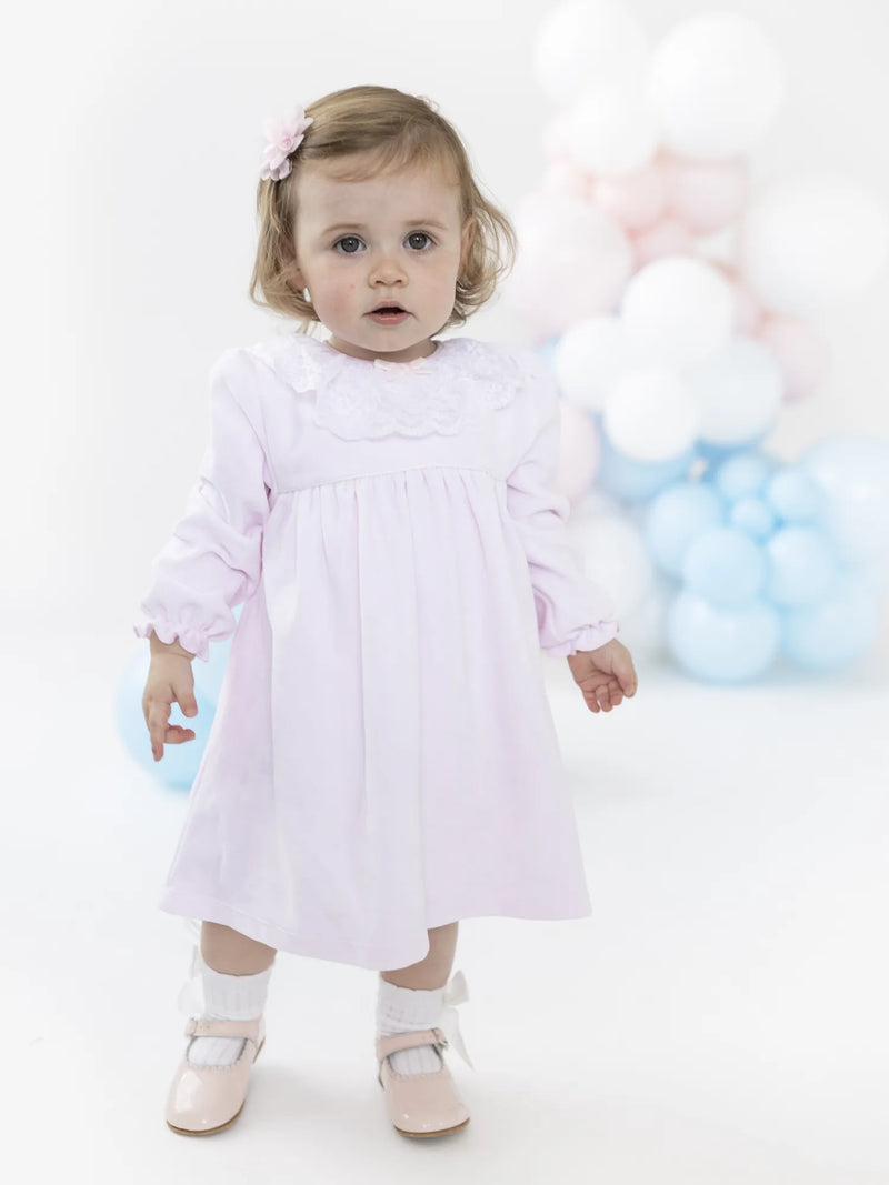 Baby girl modelling the Blues Baby tivoli dress.
