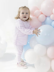 Baby girl in pink tivoli leggings set by Blues Baby.