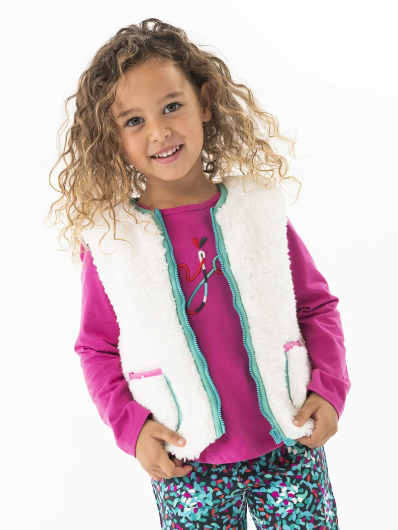 Girl wearing the Boboli bouclé gilet.