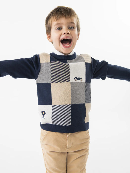 Boy modelling the Boboli checkerboard jumper.