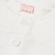 Closer look at the Boboli denim jacket showing detail of the frayed trim along the collar.