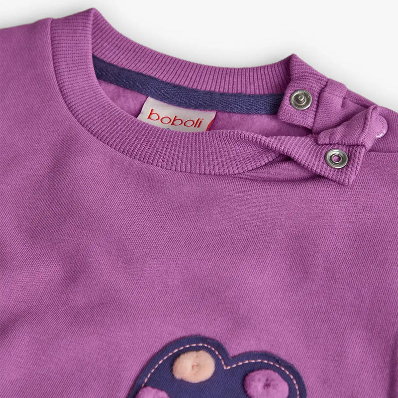 Boboli purple top with flower appliqué.