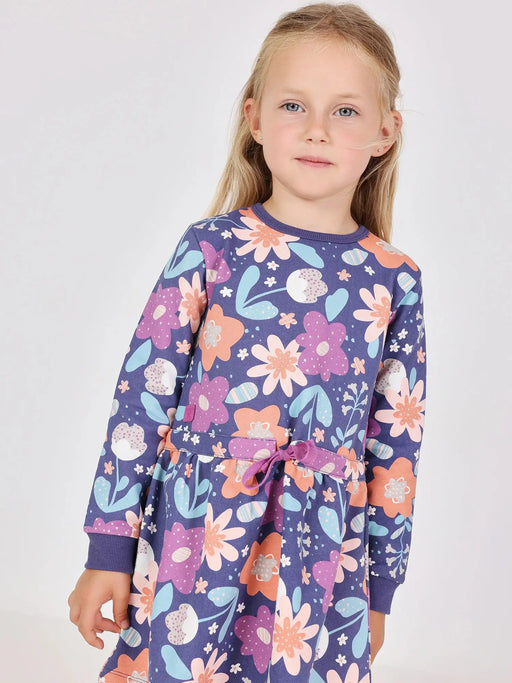 Girl wearing the Boboli floral print dress & tights.