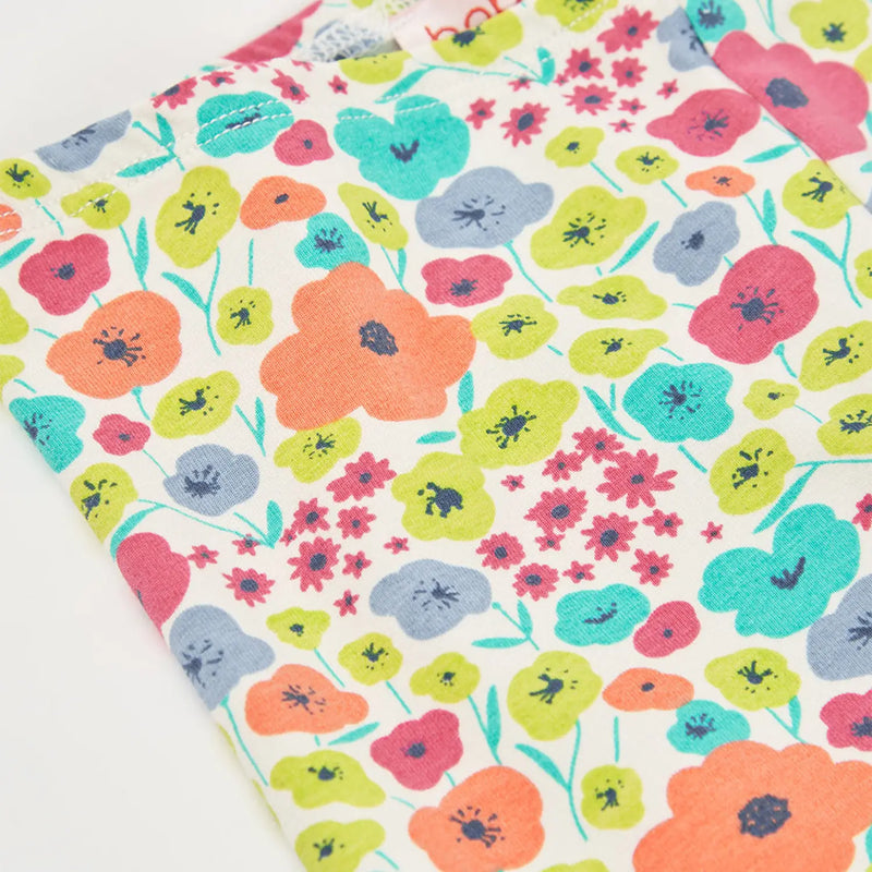Boboli girl's leggings with brightly coloured floral pattern.