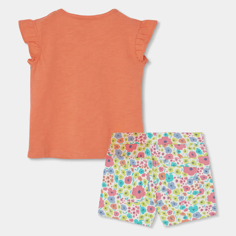 Rear view of the Boboli orange floral print shorts set.