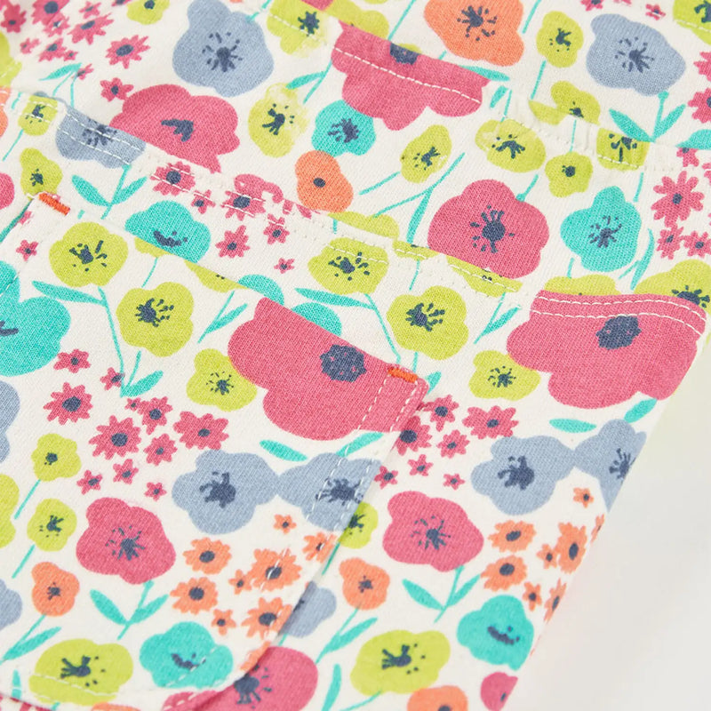 Boboli white shorts with brightly coloured floral pattern.
