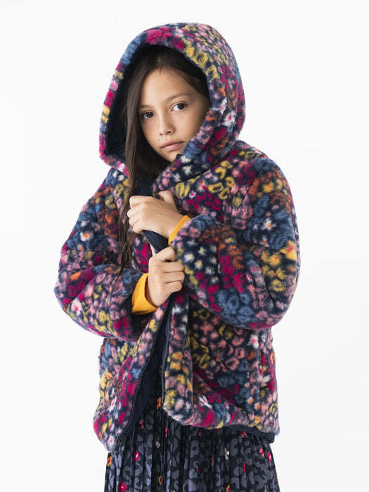 Girl wearing the Boboli reversible coat.