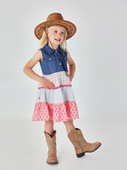 Girl wearing the Boboli sleeveless dress, complete with cowboy boots and hat. 