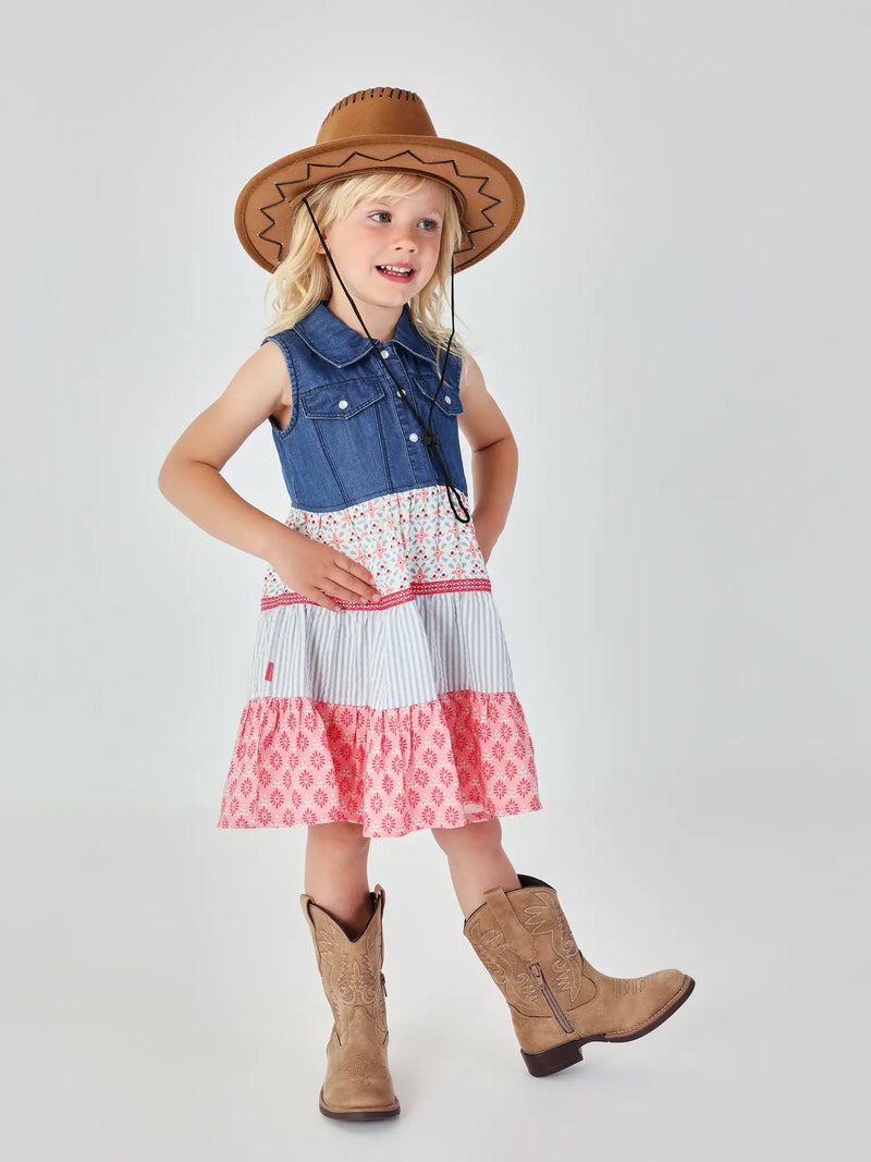 Girl wearing the Boboli sleeveless dress, complete with cowboy boots and hat. 