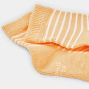 Boboli girl's socks with orange and white striped design.
