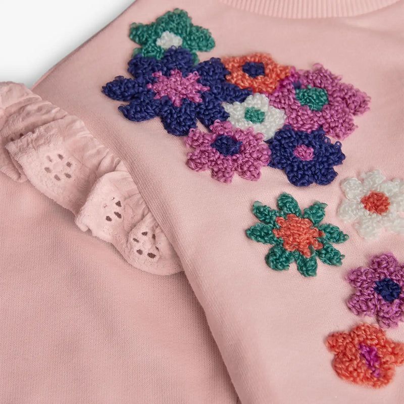 Boboli sweatshirt with crochet flowers at the shoulder.