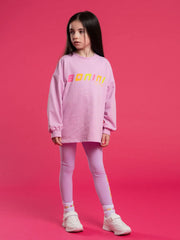 Girl wearing the Bonini lilac groove sweatshirt.