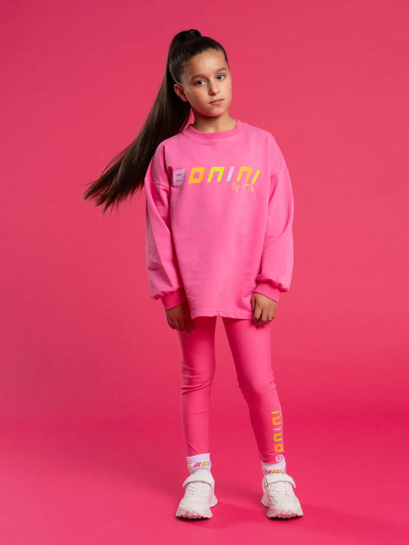 Girl wearing the Bonini groove sweatshirt.