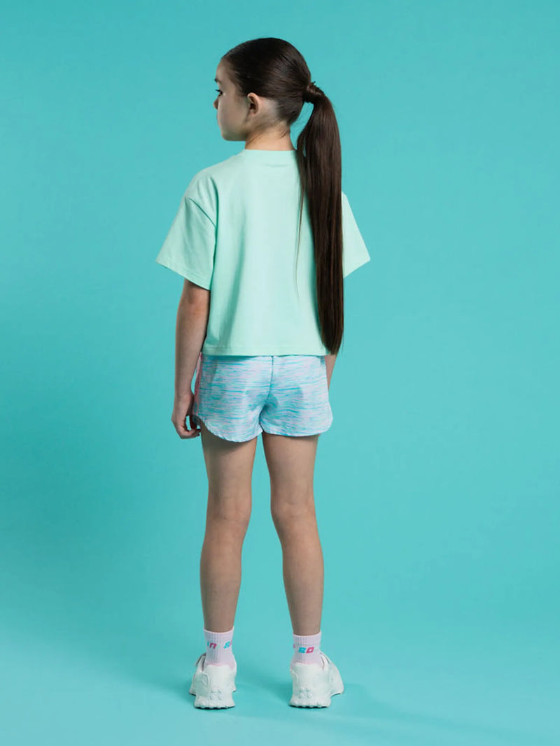 Girl wearing the Bonini shine cropped t-shirt.