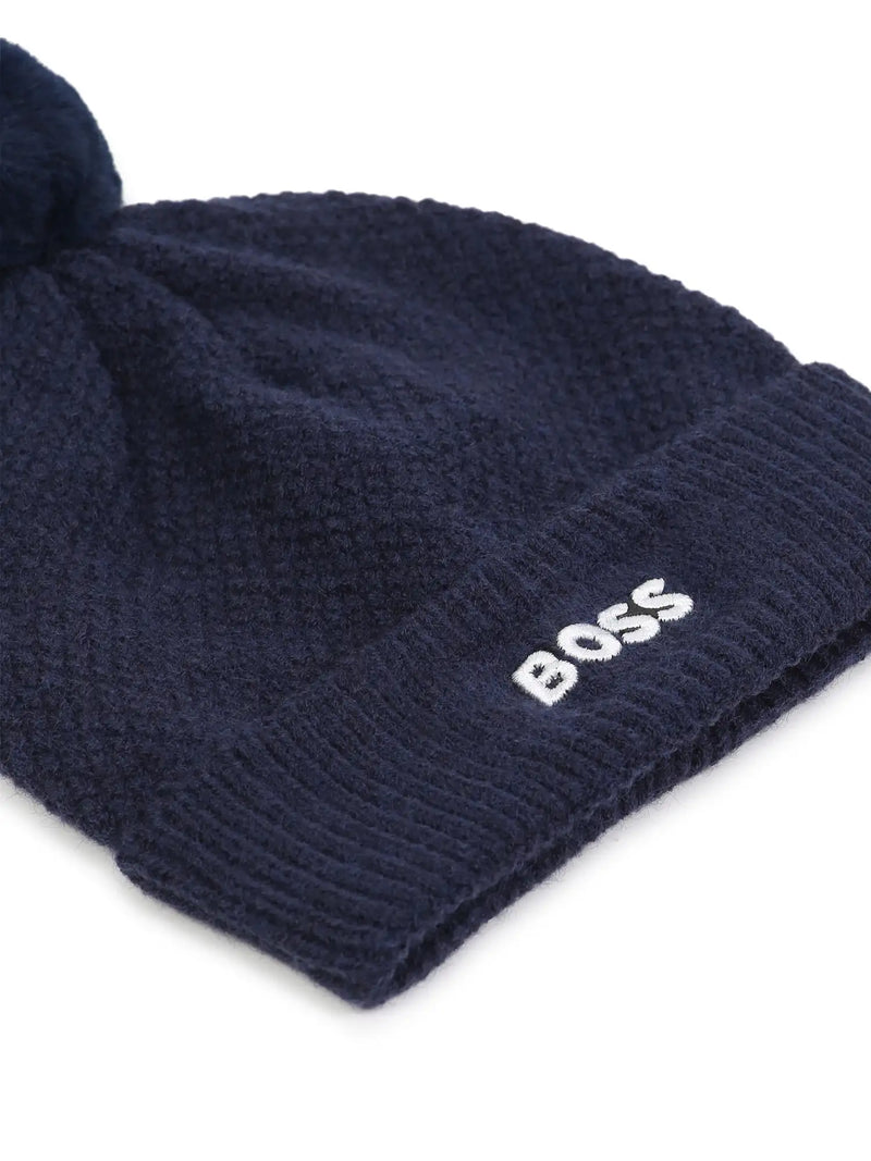 Closer look at the BOSS bobble hat showing detail of the white embroidered logo.