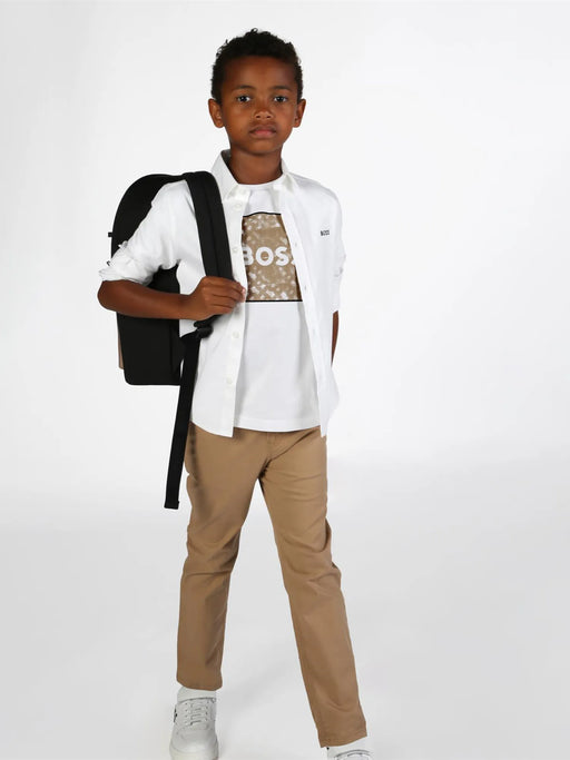 Boy modelling the BOSS chinos.